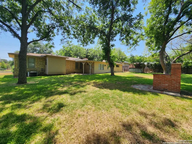 a view of backyard with green space