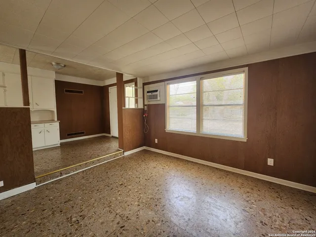 an empty room with windows