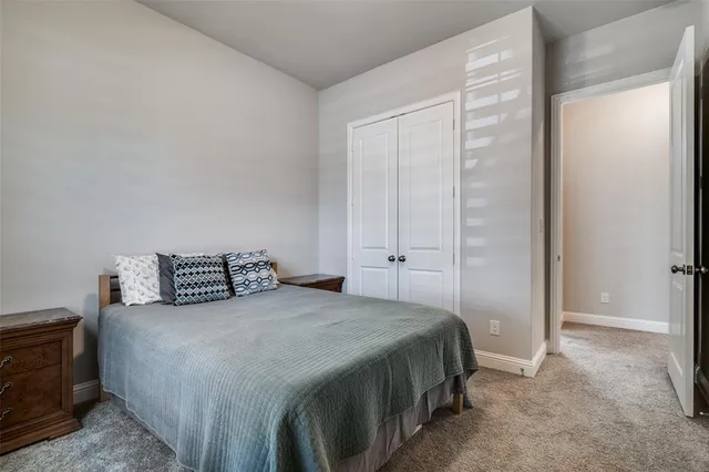 a bedroom with a bed and a tv