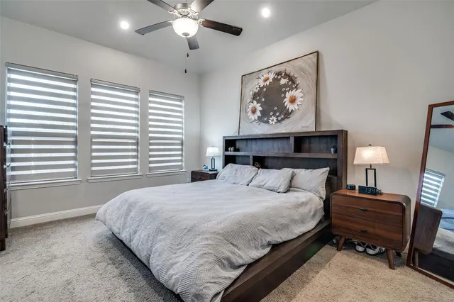 a bedroom with bed and a window