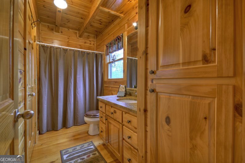 112 Seneca Drive Ellijay, GA 30540 - Photo 11 of 32 a bathroom with a sink toilet and shower