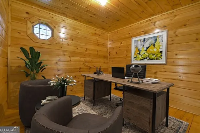 a dining room with furniture and wooden floor