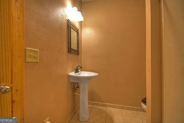a bathroom with a sink and mirror