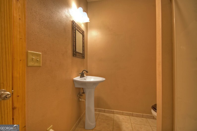 112 Seneca Drive Ellijay, GA 30540 - Photo 18 of 32 a bathroom with a sink and mirror
