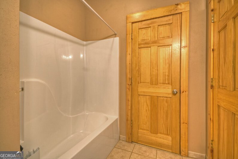 112 Seneca Drive Ellijay, GA 30540 - Photo 19 of 32 a bathroom with a shower and a bath tub