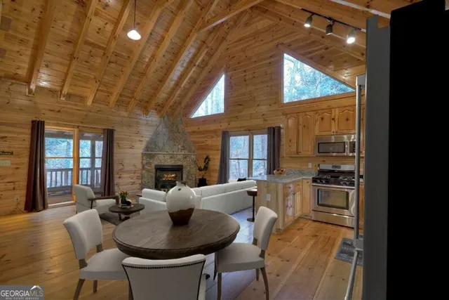 a view of a dining room with furniture window and outside view