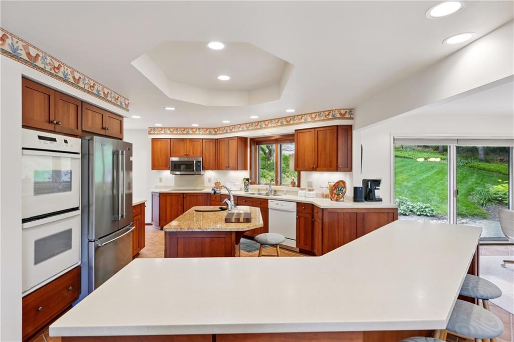 314 Winters Road Butler, PA 16002 - Photo 20 of 50 a large kitchen with kitchen island a large counter top space a sink stainless steel appliances and cabinets