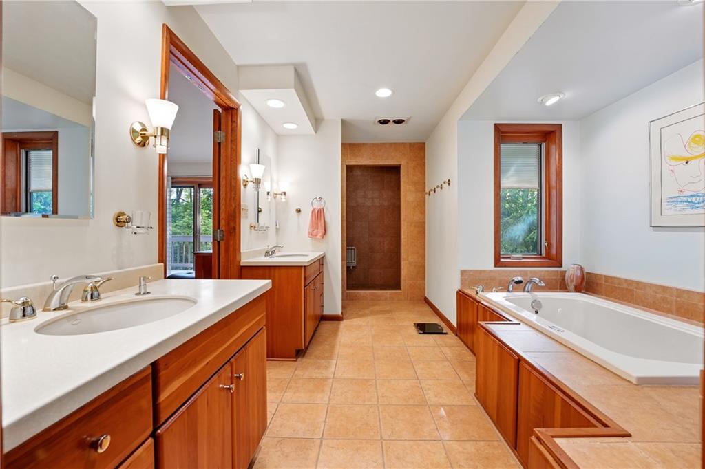 314 Winters Road Butler, PA 16002 - Photo 29 of 50 a spacious bathroom with a tub sink and mirror