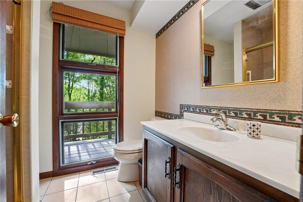 314 Winters Road Butler, PA 16002 - Photo 39 of 50 a bathroom with a sink and a mirror