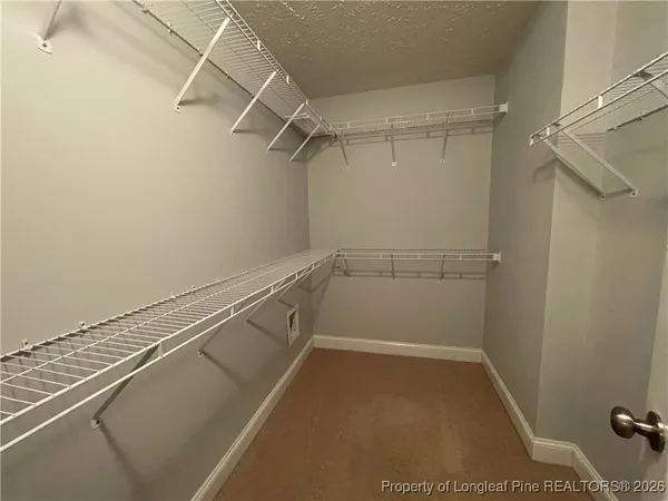 a view of a room with racks on the wall