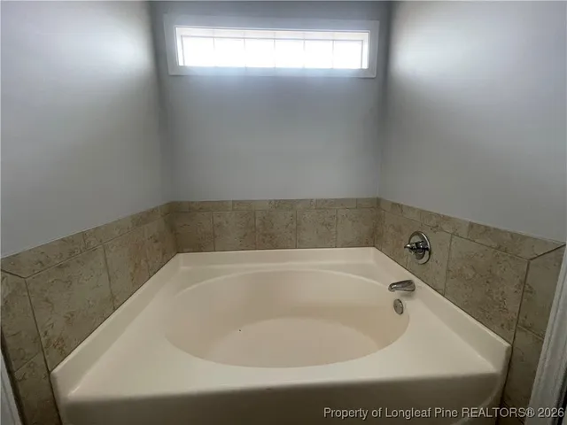 a close up of a bathtub in a bathroom