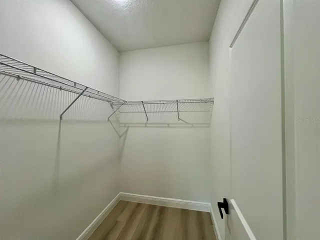 a view of a room with racks on the wall