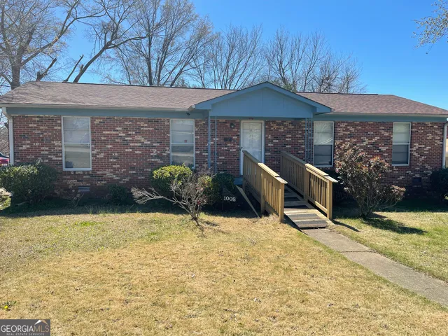 a backyard of a house with seating space