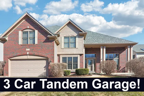 a front view of a house with a garage