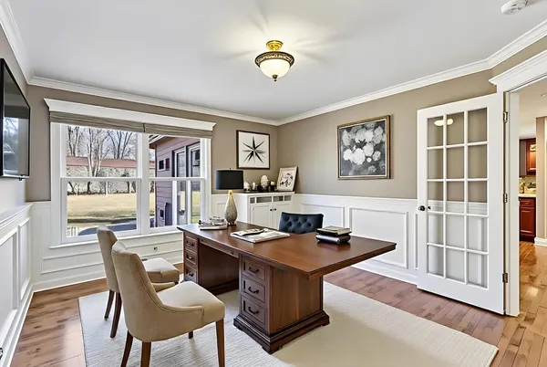 a dining room with furniture and window