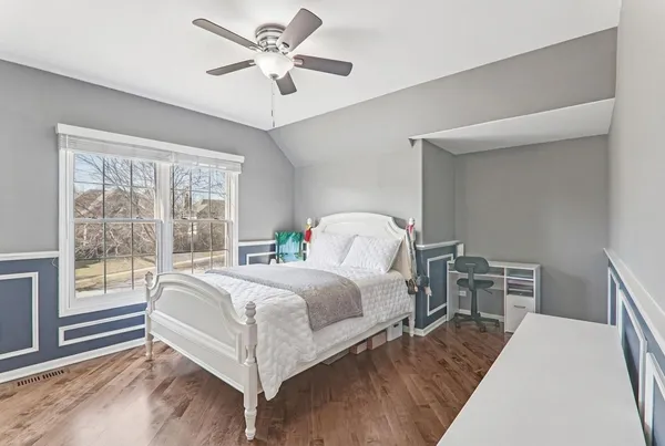 a bed room with a bed and a window