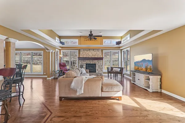 a living room with fireplace furniture and a flat screen tv
