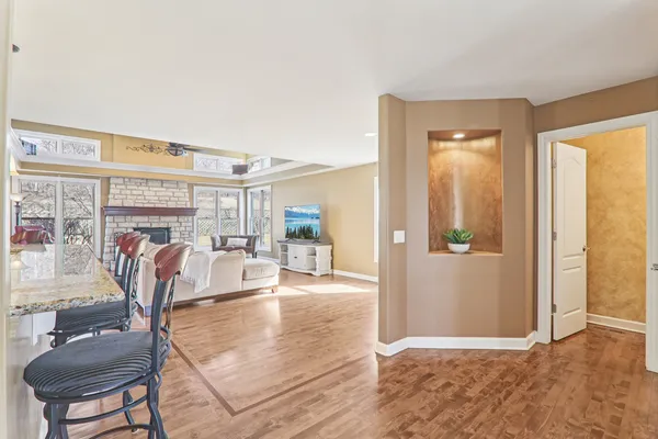 a view of a living room and a balcony