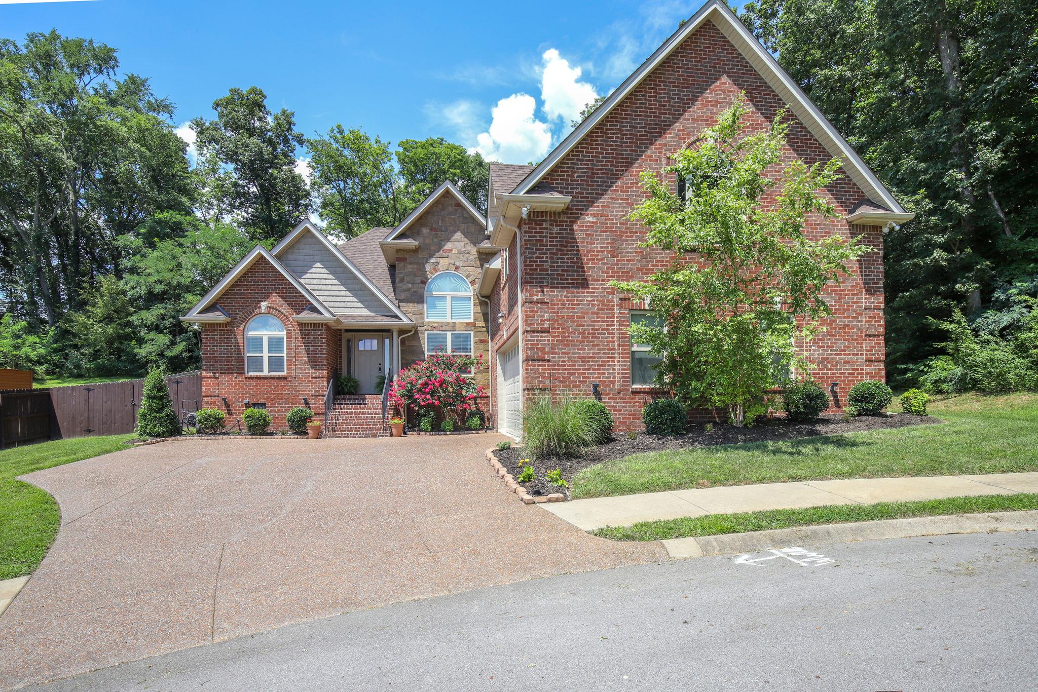 67 Remington Road Lebanon, TN 37090 - Photo 2 of 26 a view of a house with a yard and potted plants