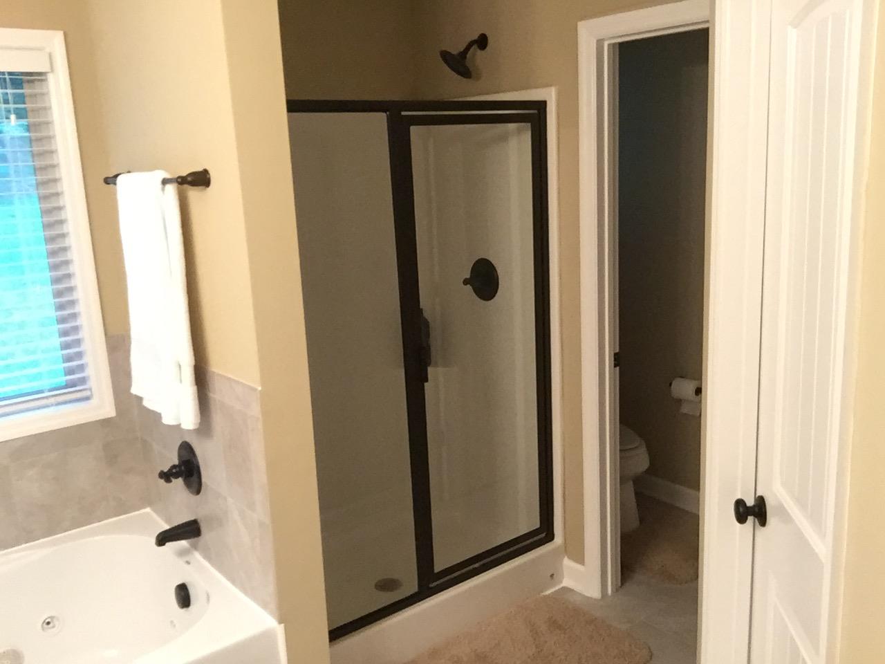 67 Remington Road Lebanon, TN 37090 - Photo 12 of 26 a bathroom with a shower and a tub