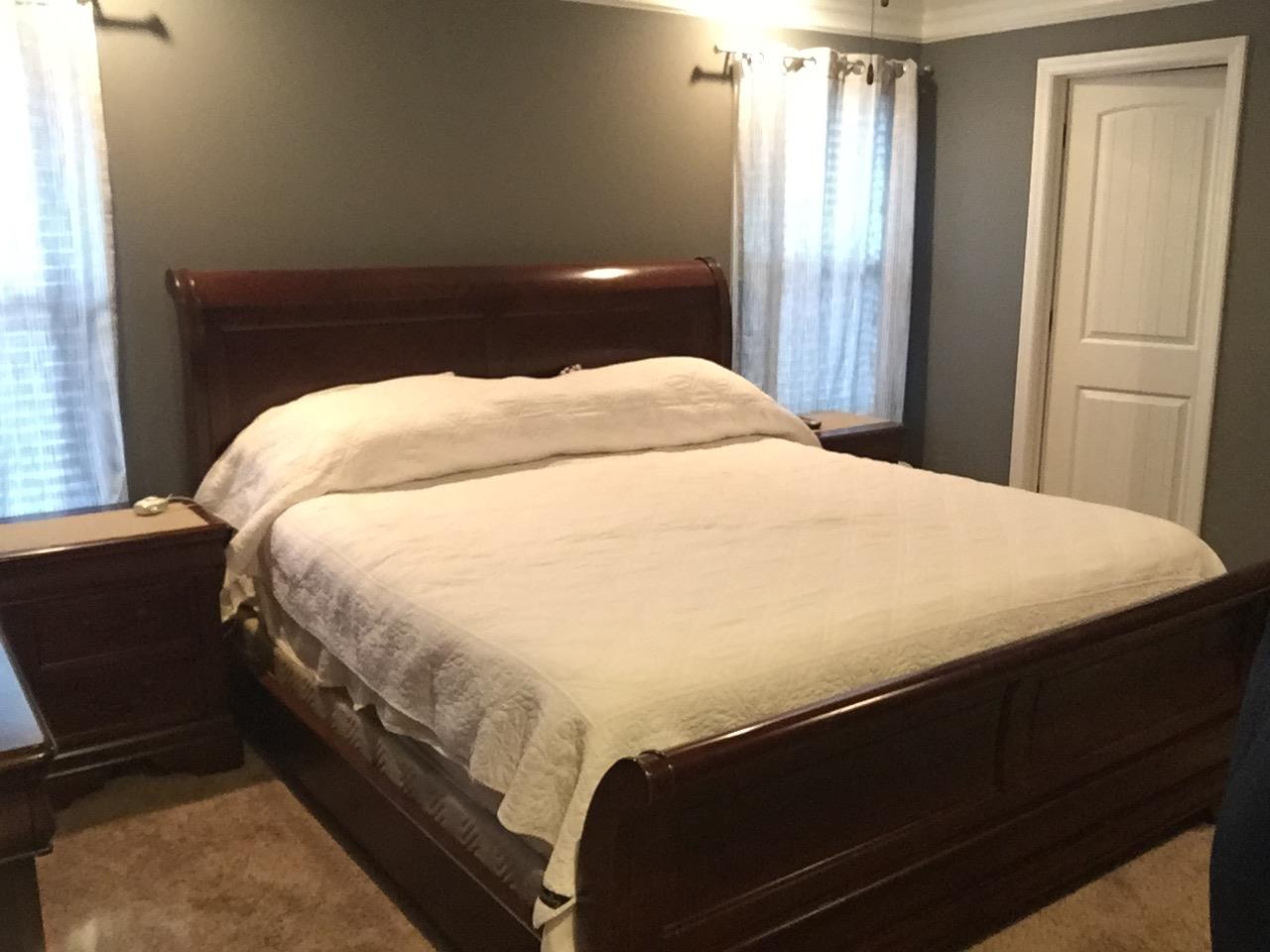 67 Remington Road Lebanon, TN 37090 - Photo 13 of 26 a bed sitting in a bedroom next to a window