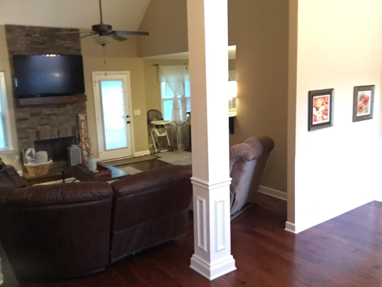 67 Remington Road Lebanon, TN 37090 - Photo 15 of 26 a living room with furniture a fireplace and a flat screen tv