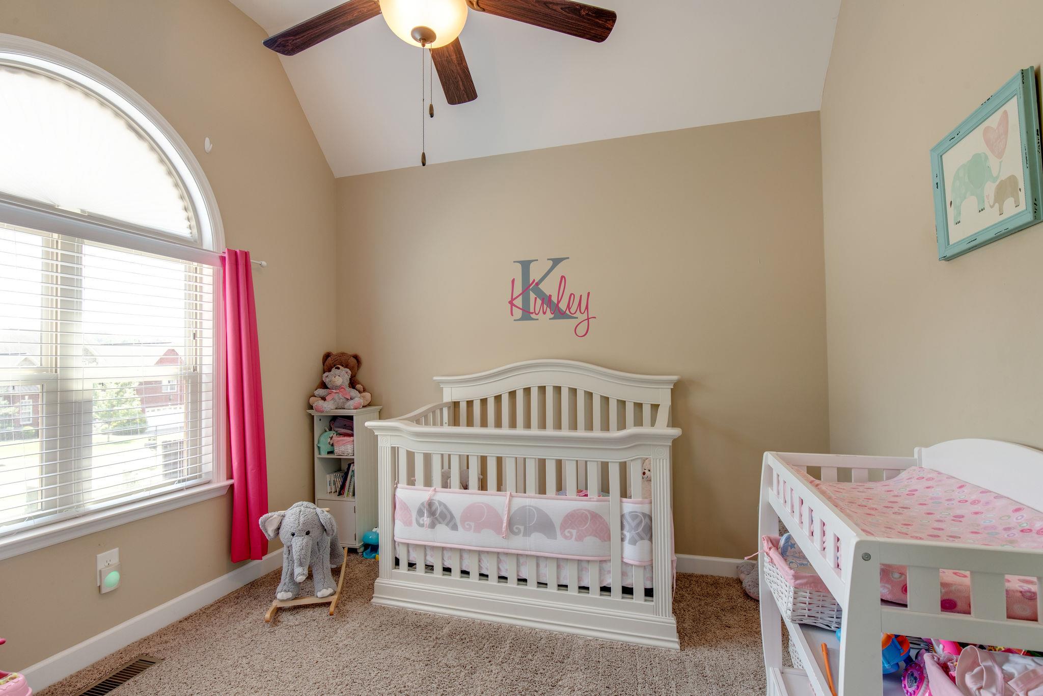 67 Remington Road Lebanon, TN 37090 - Photo 19 of 26 a bedroom with a bed and a window