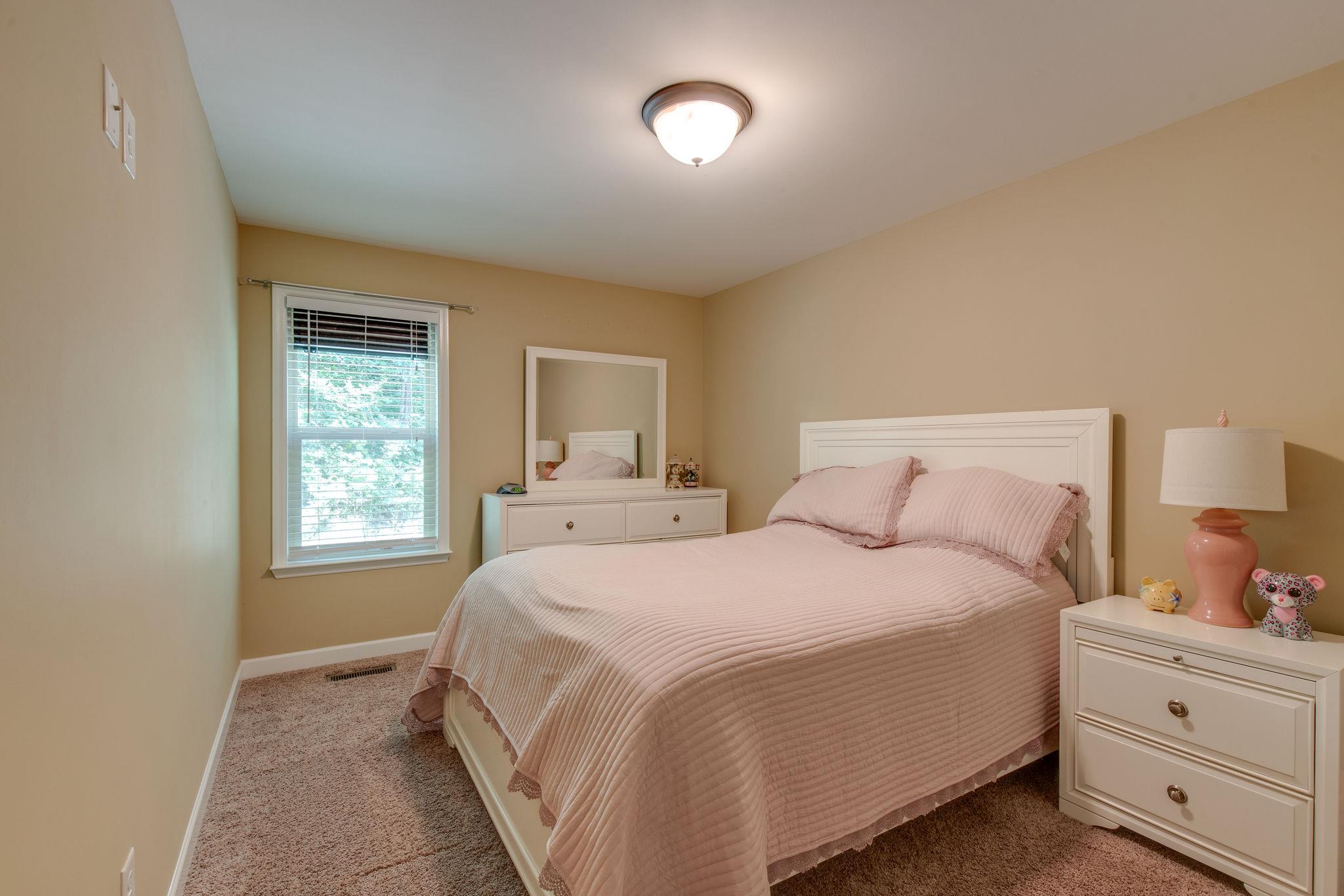 67 Remington Road Lebanon, TN 37090 - Photo 20 of 26 a bedroom with a bed and a window