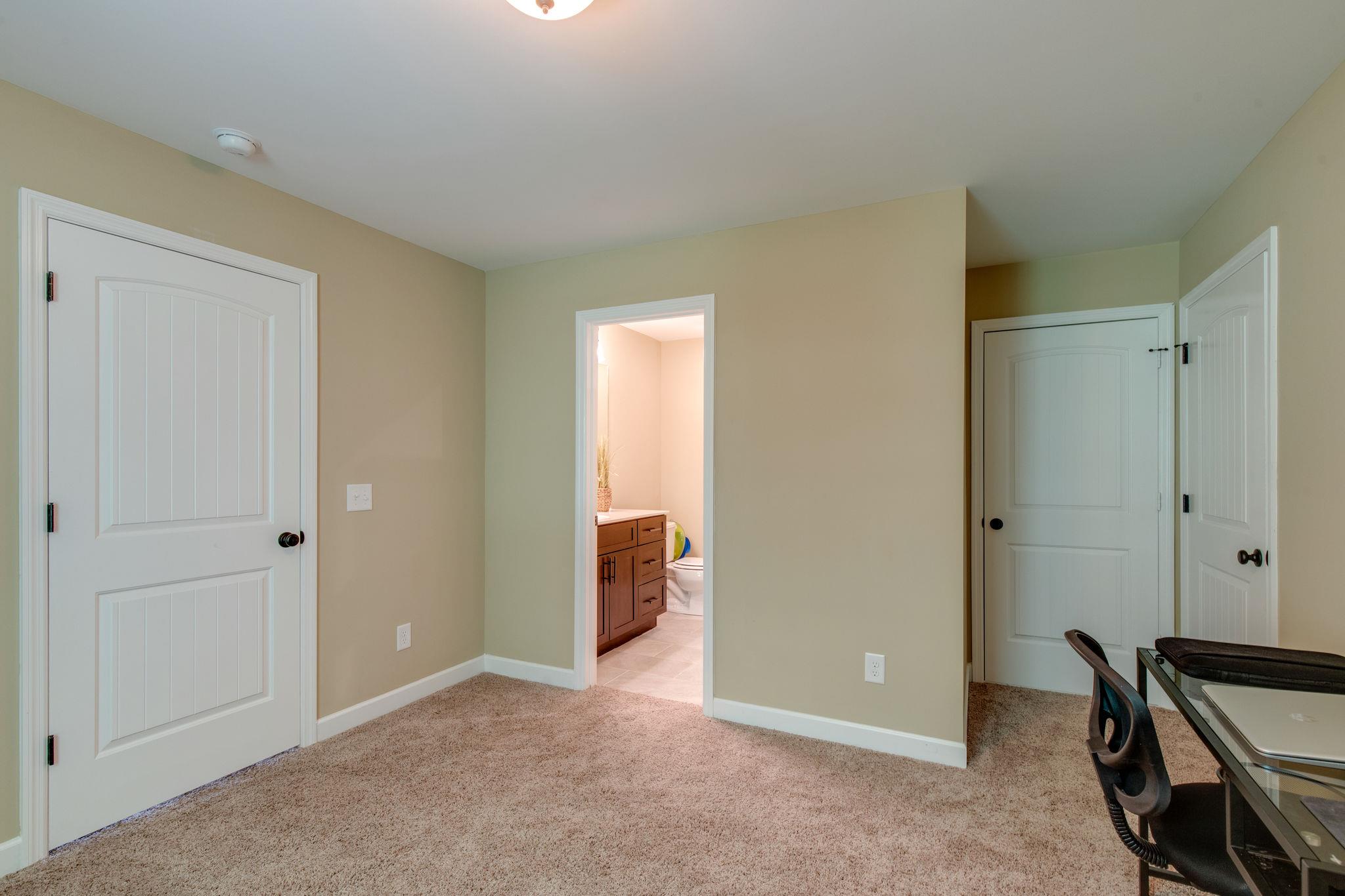 67 Remington Road Lebanon, TN 37090 - Photo 22 of 26 an empty room with closet and a bathroom