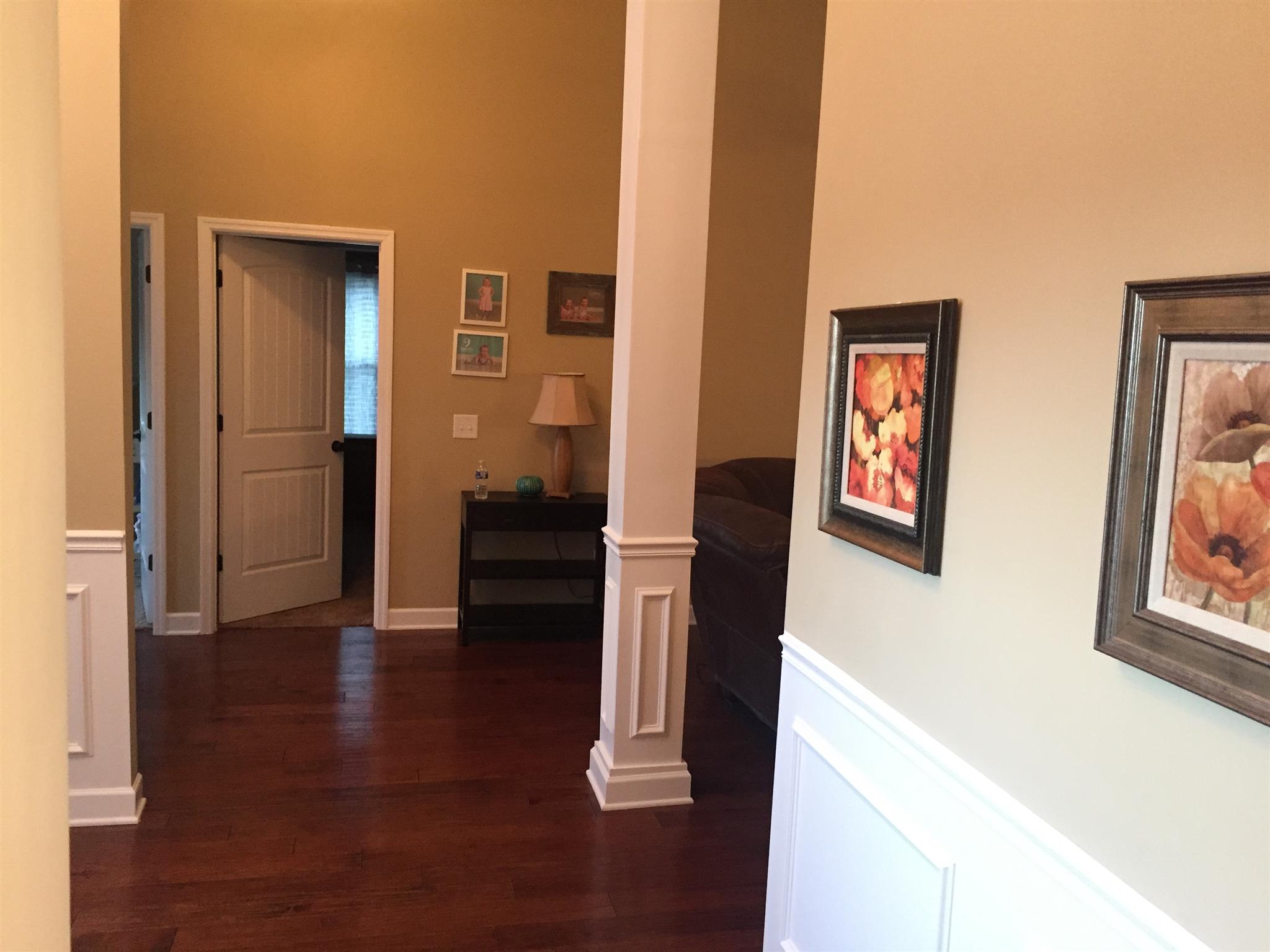 67 Remington Road Lebanon, TN 37090 - Photo 4 of 26 a view of a hallway with wooden floor and stairs