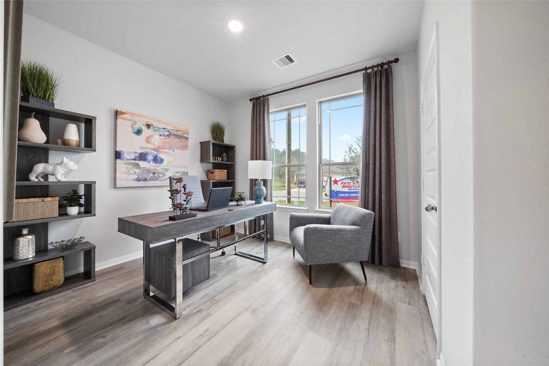 10912 Independence Road Cleveland, TX 77328 - Photo 11 of 25 a living room with furniture and a wooden floor