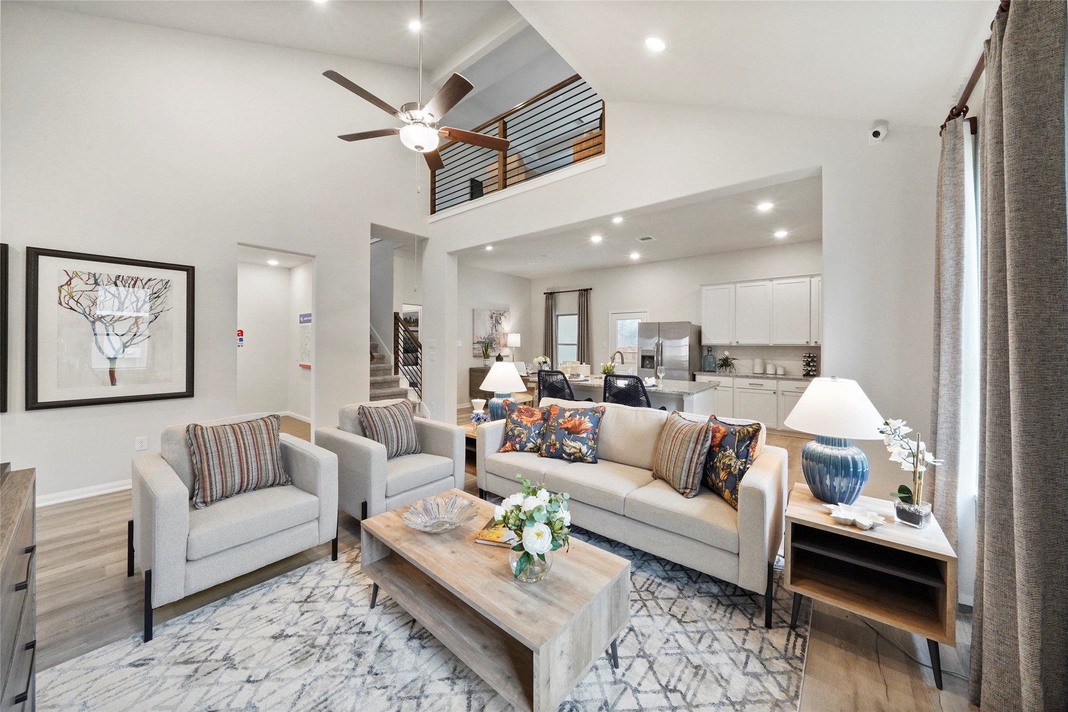 10912 Independence Road Cleveland, TX 77328 - Photo 2 of 25 a living room with furniture kitchen view and a chandelier