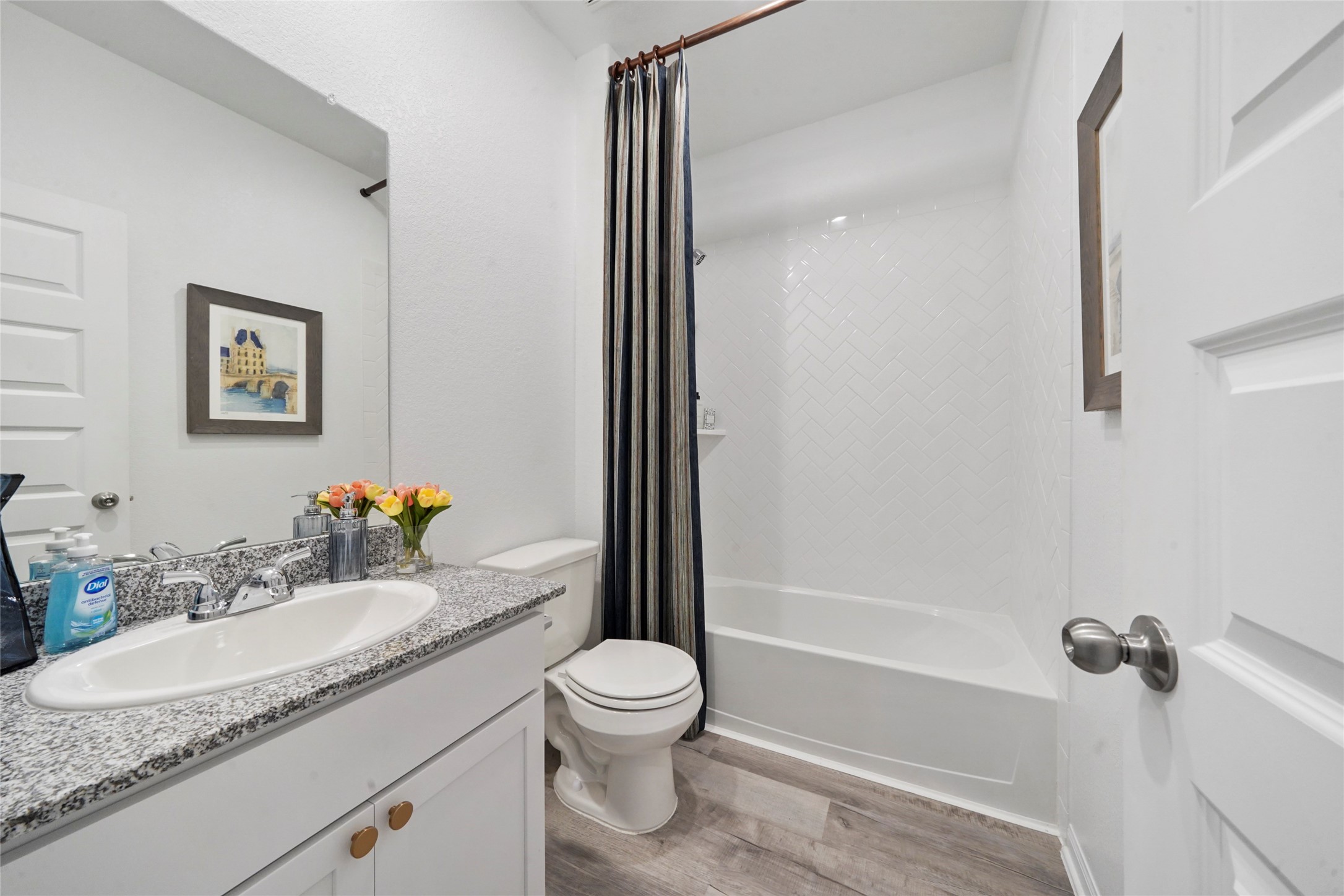 10912 Independence Road Cleveland, TX 77328 - Photo 23 of 25 a bathroom with a granite countertop sink toilet and shower