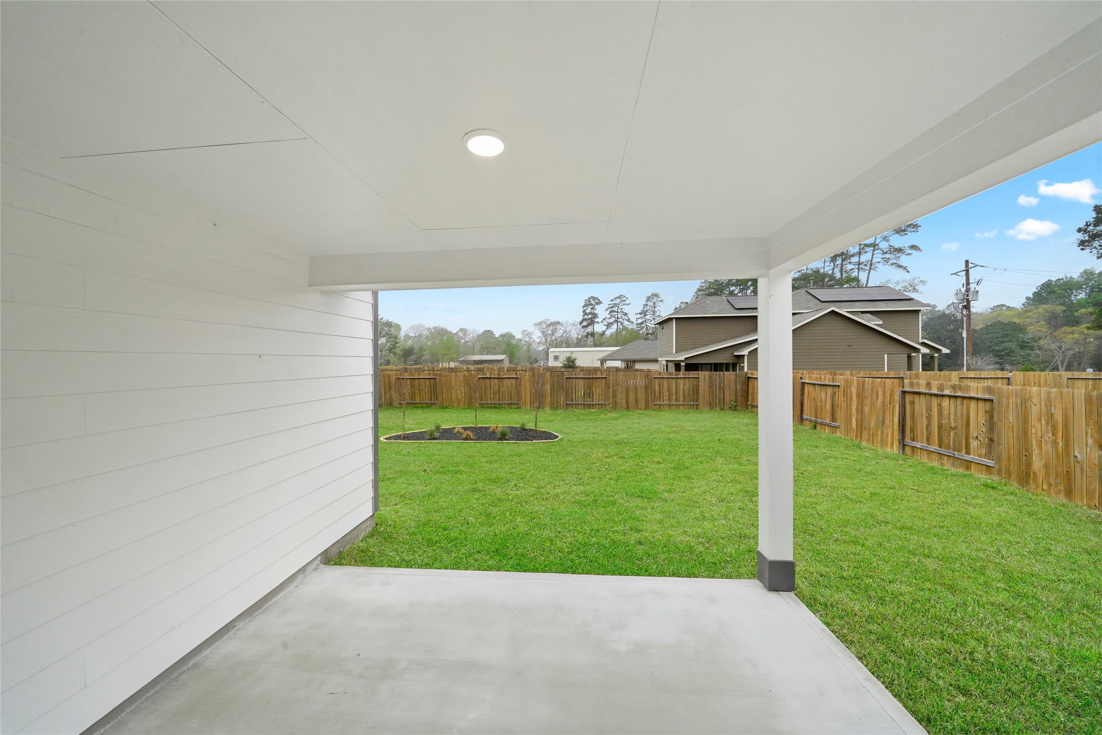 10912 Independence Road Cleveland, TX 77328 - Photo 24 of 25 a view of a backyard with plants and large trees