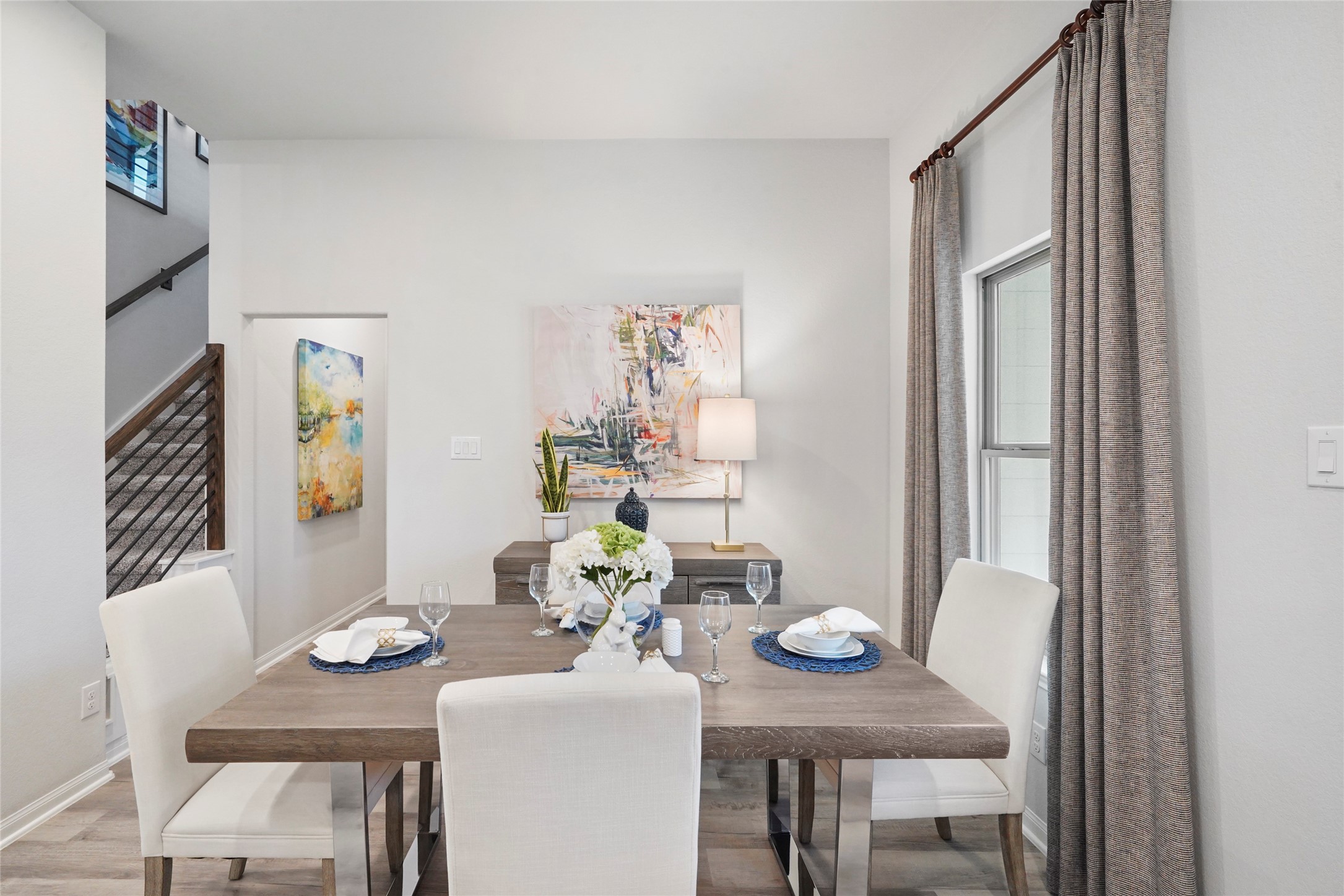 10912 Independence Road Cleveland, TX 77328 - Photo 10 of 25 a view of a dining room with furniture and wooden floor
