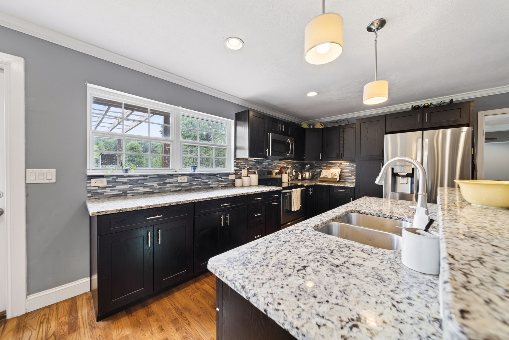 8023 Bethlehem Road Springfield, TN 37172 - Photo 32 of 55 a kitchen with stainless steel appliances kitchen island granite countertop a sink stove and wooden cabinets