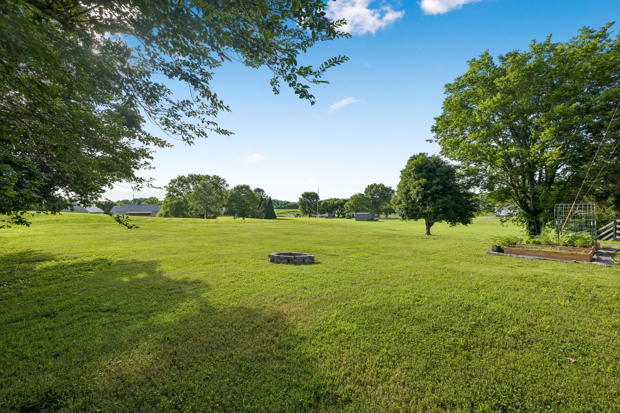1326 Shahan Road Pleasant View, TN 37146 - Photo 39 of 41 a view of a green field with wooden fence