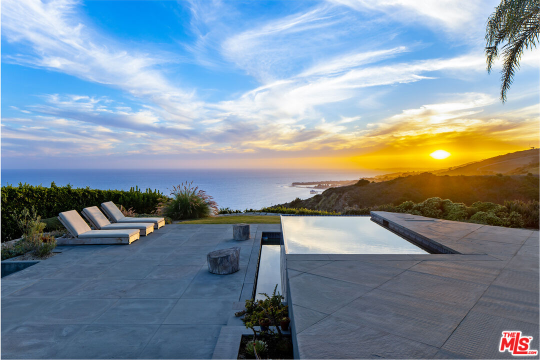 22407 Carbon Mesa Road Malibu, CA 90265 - Photo 32 of 33 a view of city from terrace with seating space