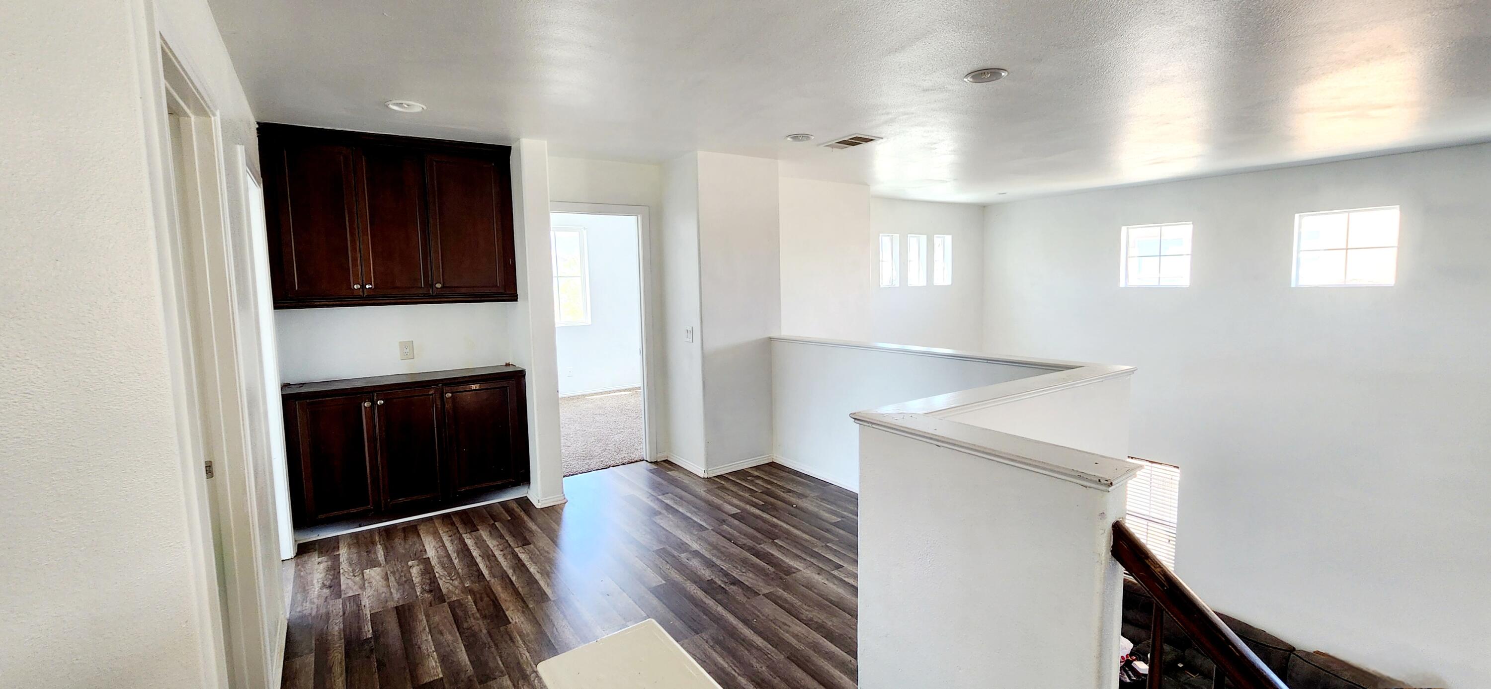 5817 Gem Court Lancaster, CA 93536 - Photo 12 of 26 a view of kitchen and hallway with wooden floor