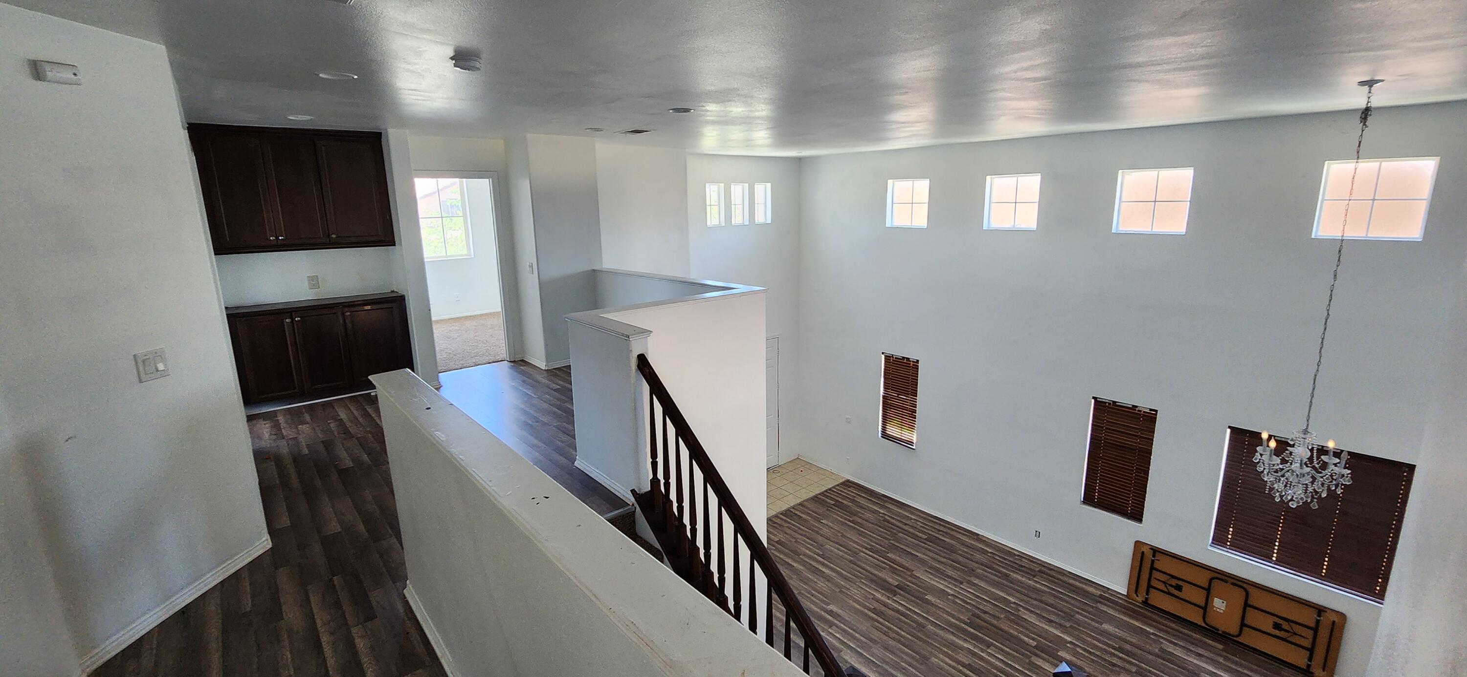 5817 Gem Court Lancaster, CA 93536 - Photo 13 of 26 a view of a livingroom with furniture stairs wooden floor and staircase