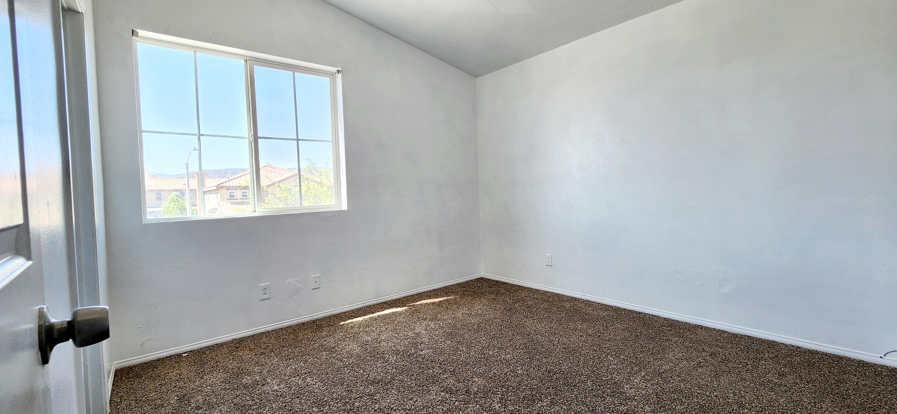5817 Gem Court Lancaster, CA 93536 - Photo 14 of 26 an empty room with a window