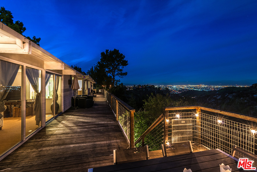 3356 Woodcliff Road Sherman Oaks, CA 91403 - Photo 1 of 15 a view of a balcony with two chairs