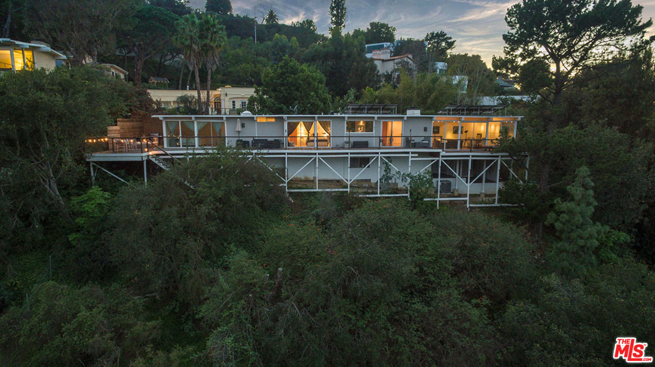 3356 Woodcliff Road Sherman Oaks, CA 91403 - Photo 11 of 15 a view of house with outdoor space and sitting area