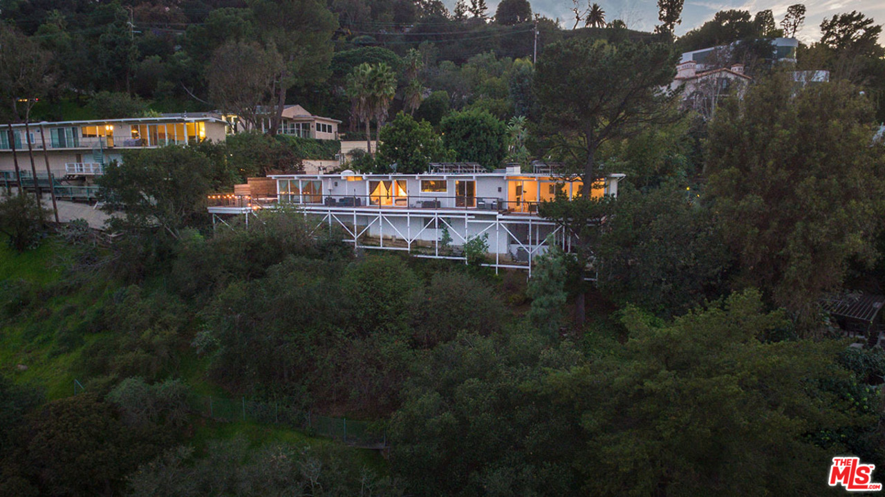 3356 Woodcliff Road Sherman Oaks, CA 91403 - Photo 12 of 15 a view of a house with a yard