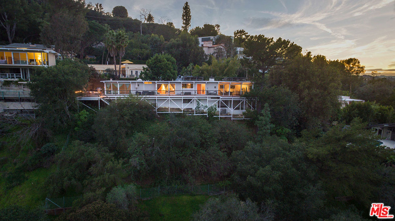3356 Woodcliff Road Sherman Oaks, CA 91403 - Photo 15 of 15 a view of swimming pool and trees in the background
