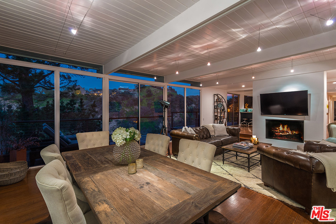 3356 Woodcliff Road Sherman Oaks, CA 91403 - Photo 4 of 15 a living room with fireplace furniture and a fireplace