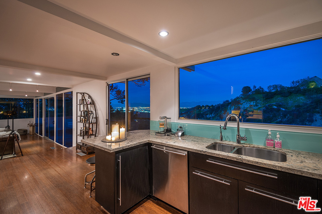 3356 Woodcliff Road Sherman Oaks, CA 91403 - Photo 5 of 15 a kitchen with lots of counter space and a sink
