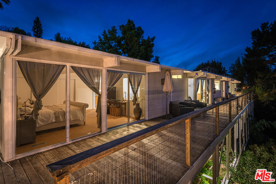 3356 Woodcliff Road Sherman Oaks, CA 91403 - Photo 7 of 15 a view of a house with backyard and deck