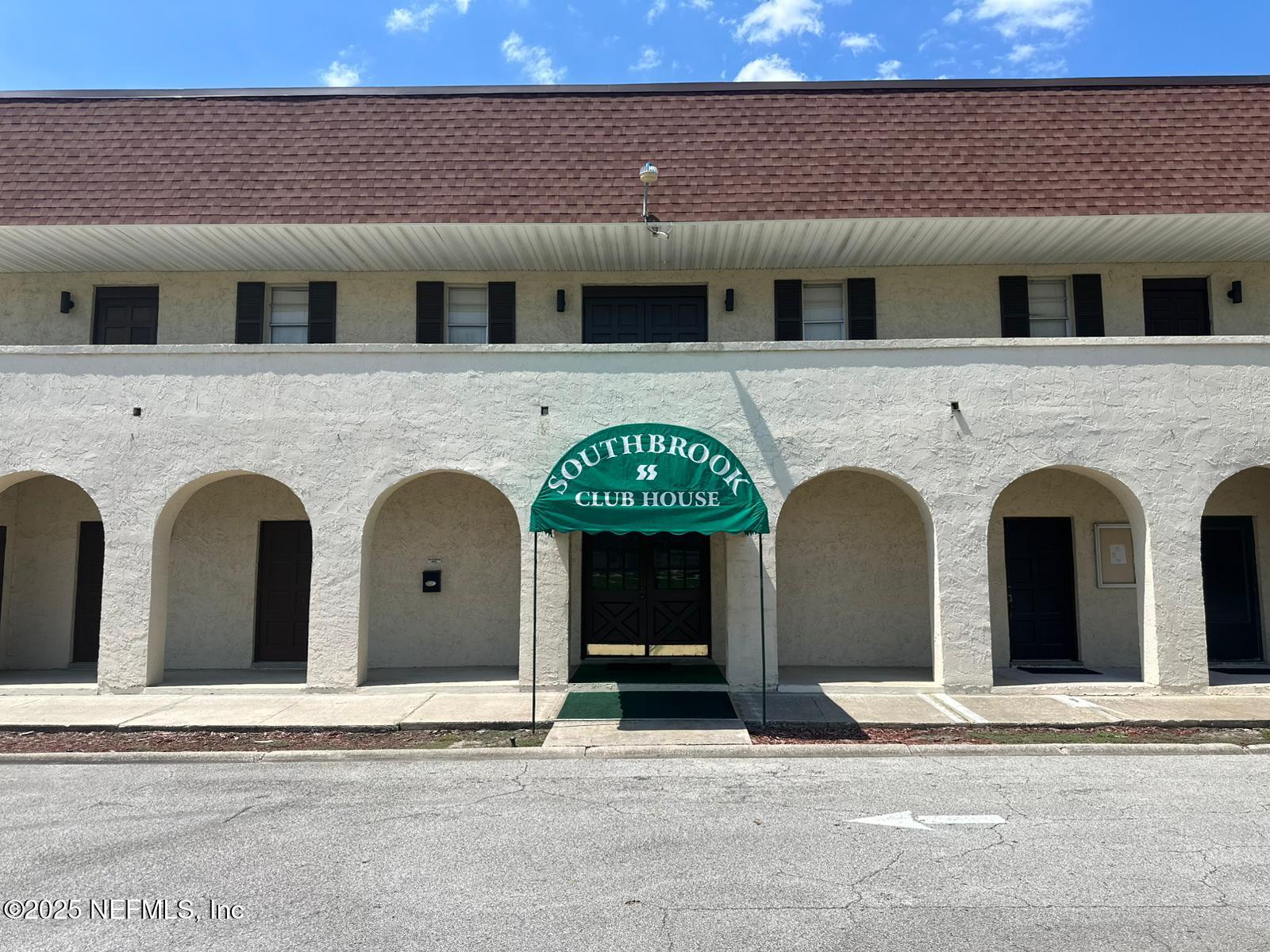 a view of building with large windows