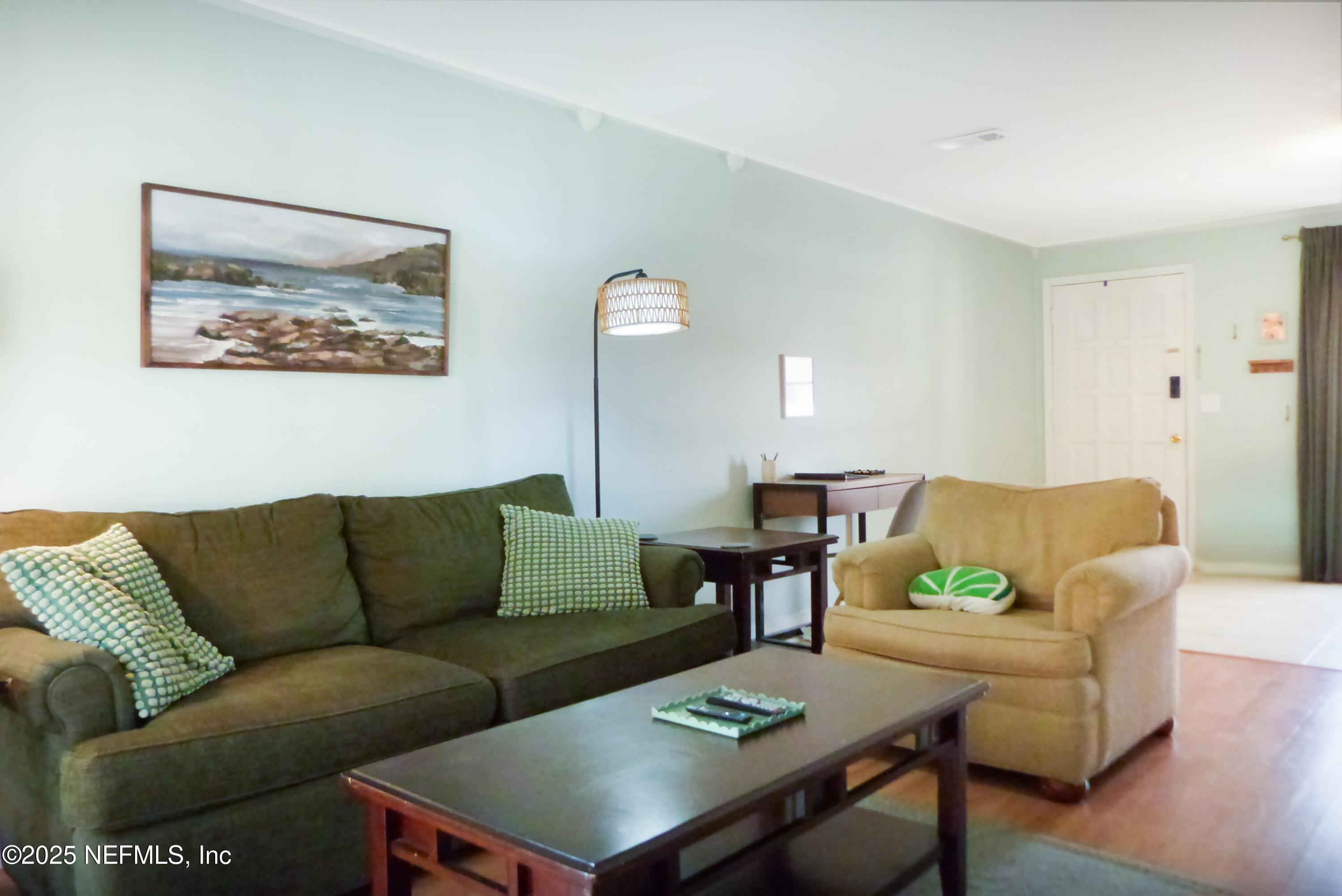 7341 El Ocho Road, Unit 5 Jacksonville, FL 32216 - Photo 3 of 9 a living room with furniture and a couch